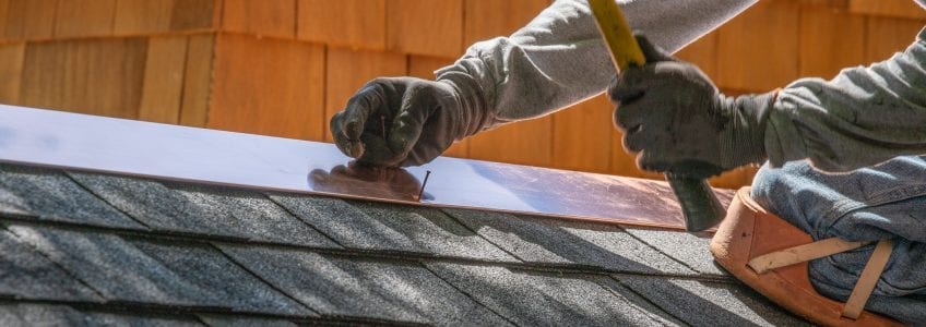 Worker Installing Asphalt Shingles