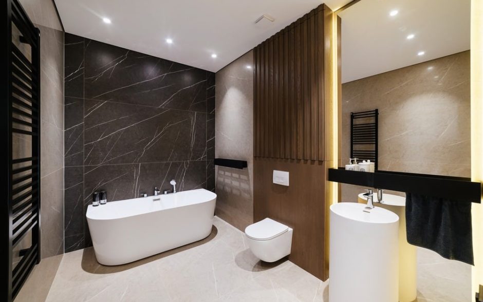 New,Large,Bathroom,With,White,Bathroom,Mirror,And,Lighting Contact A to Z for Your Bathroom Remodel Today!